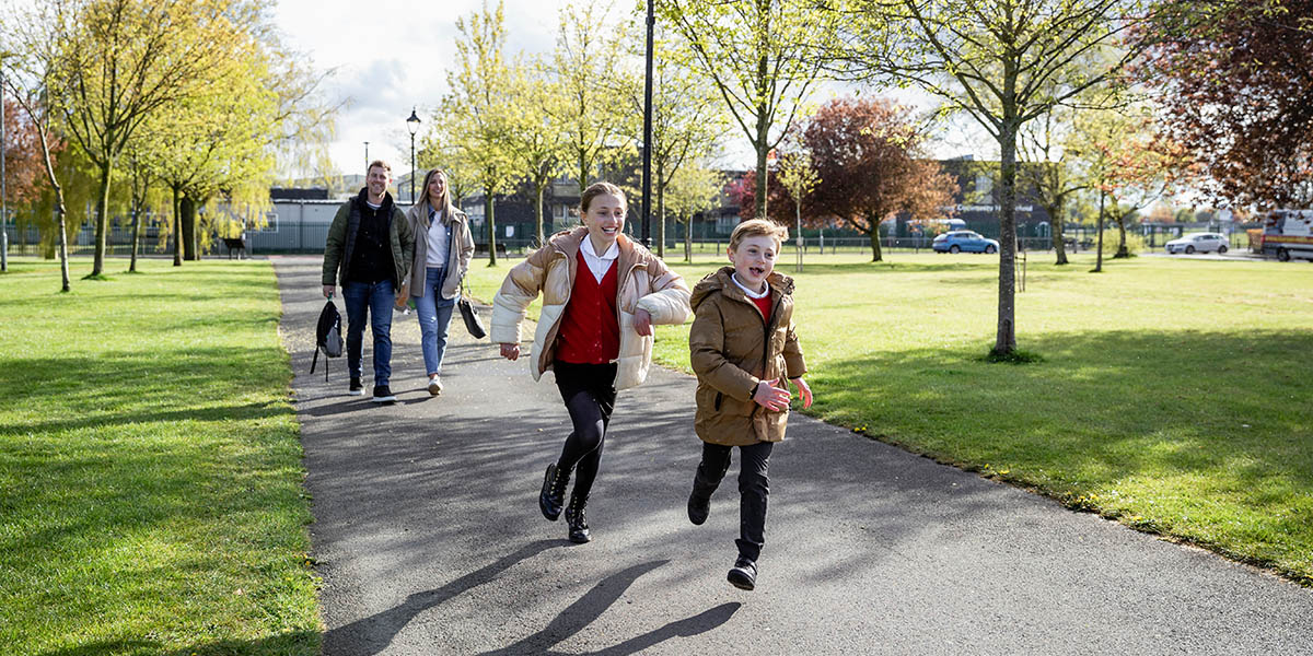 Parents and children walking to school