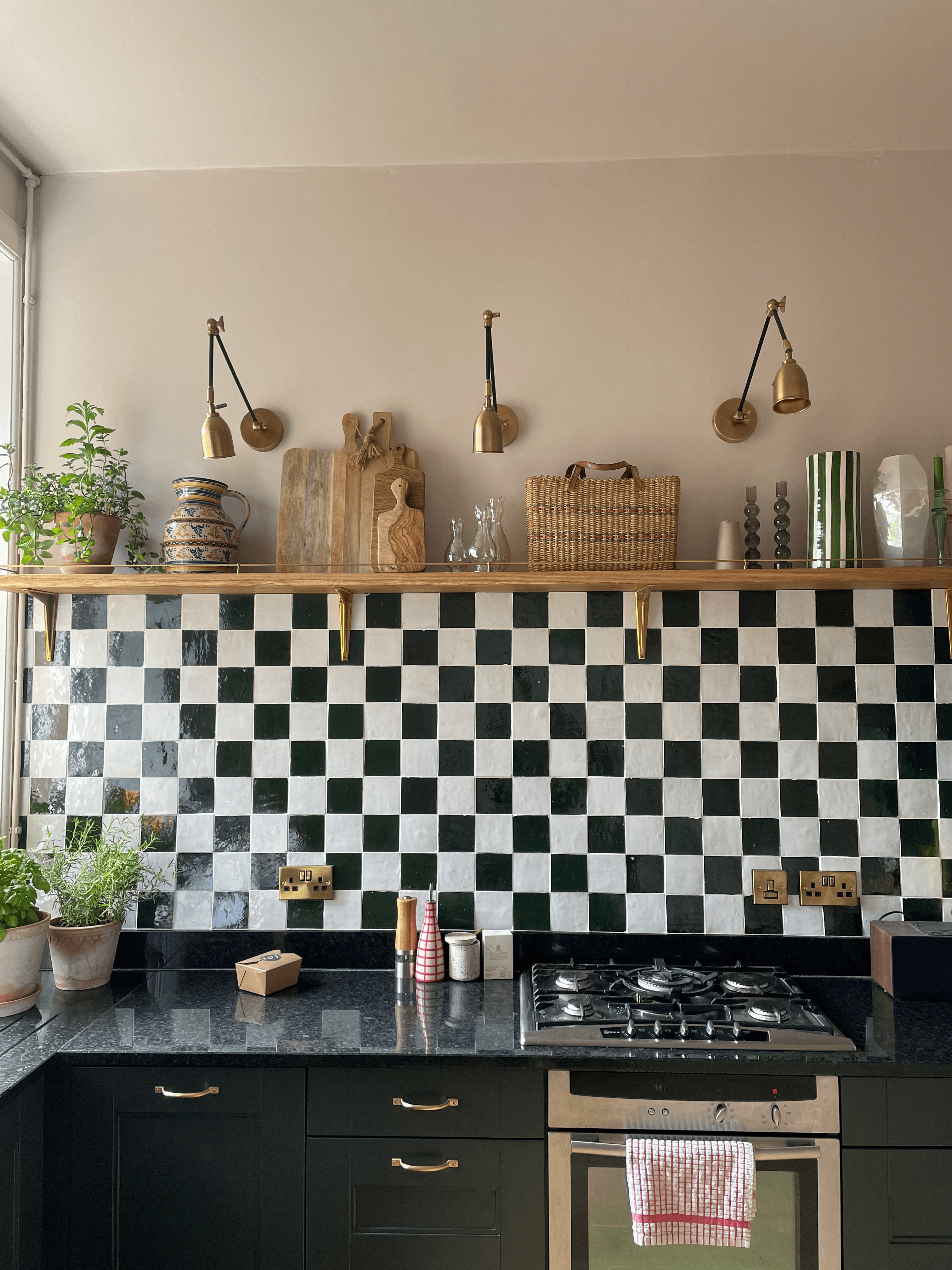 Pink kitchen with checkerboard tiles