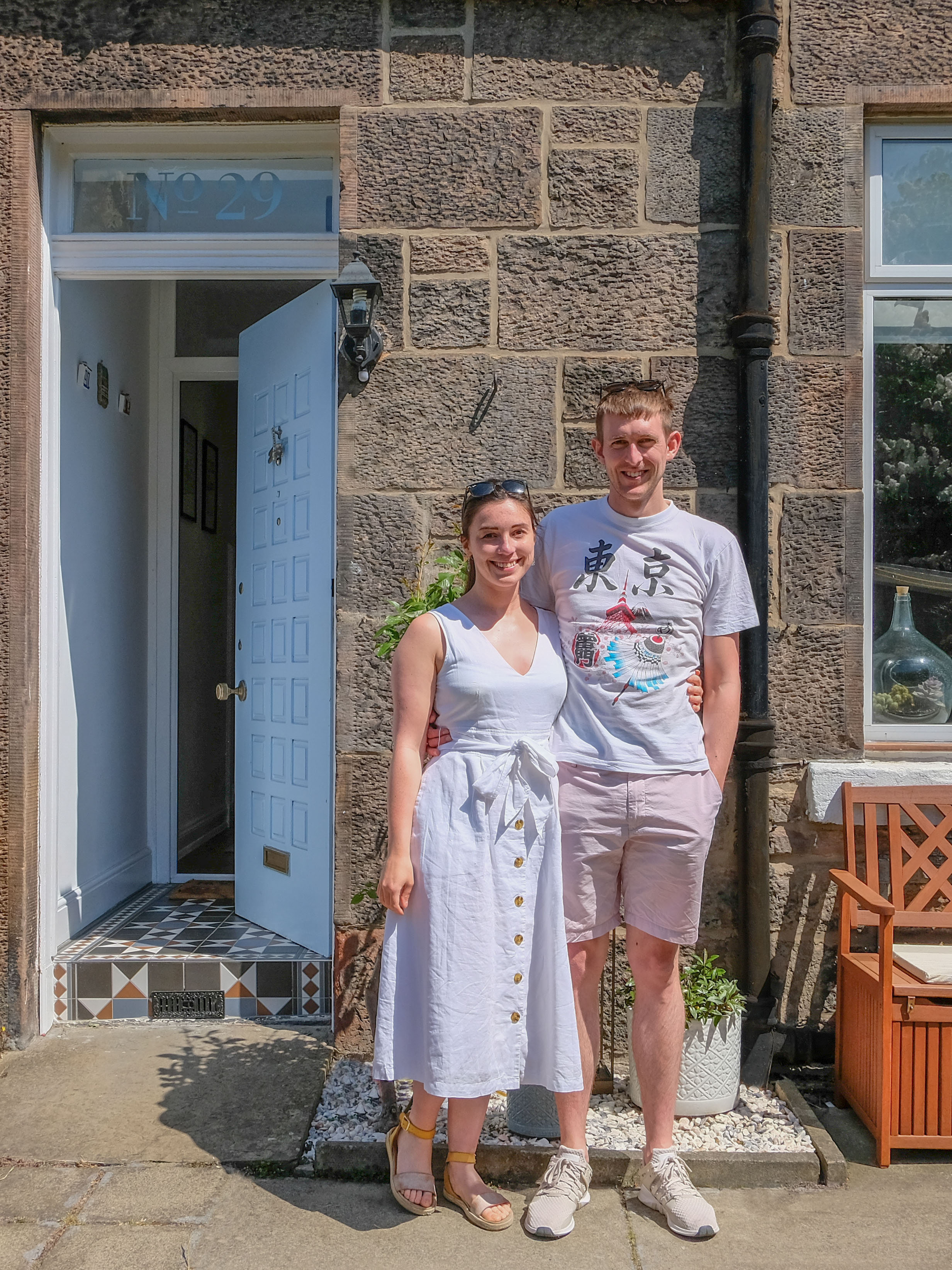 Couple outside Edinburgh home