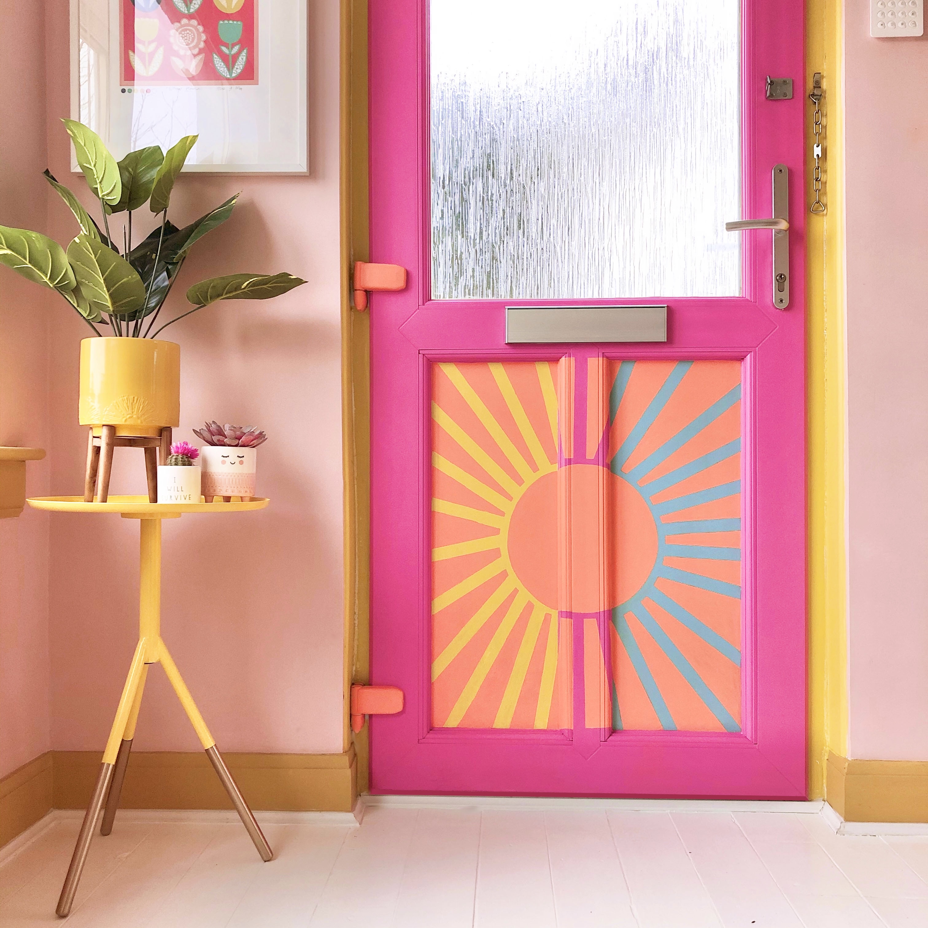 Brightly coloured front door and hallway